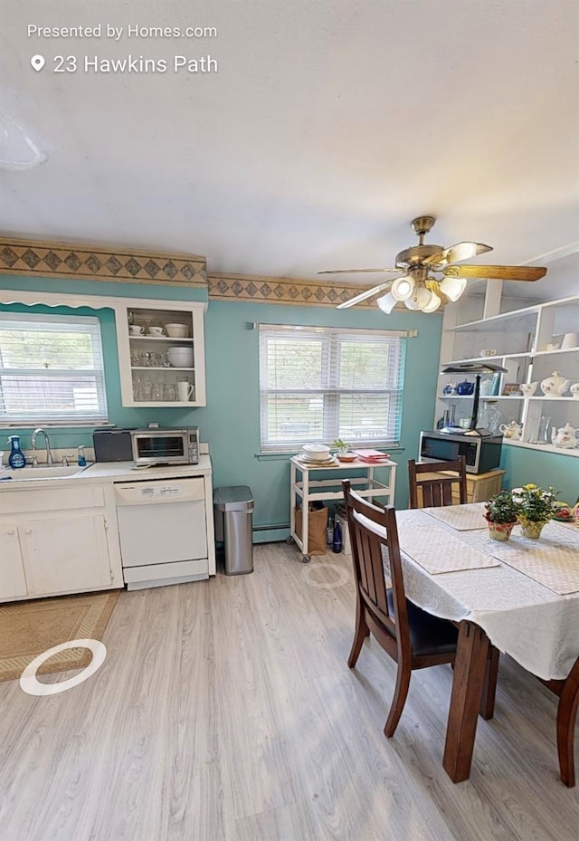 23 Hawkins Path, Coram, NY 11727 - dining space with light wood-style floors, a ceiling fan, and baseboard heating