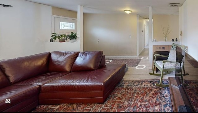 23 Hawkins Path, Coram, NY 11727 - living area featuring wood finished floors and baseboards