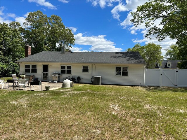 23 Hawkins Path, Coram, NY 11727 - rear view of property with a gate, central air condition unit, a patio area, and a chimney