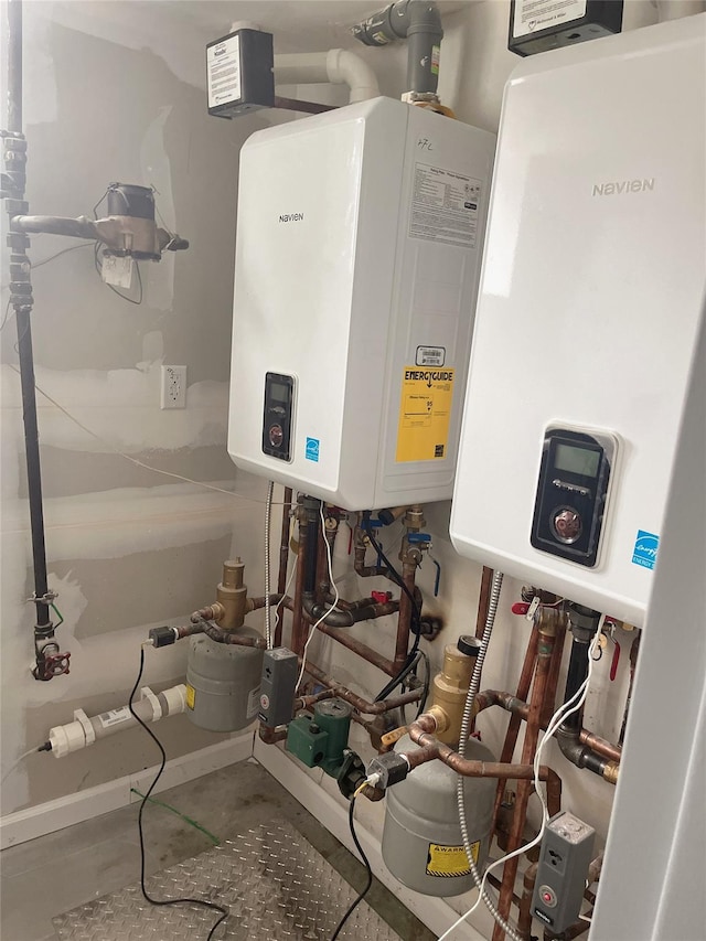 utility room with tankless water heater