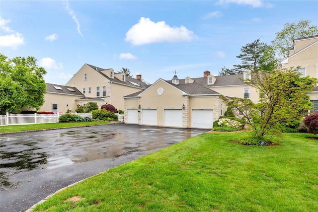traditional-style home featuring driveway, stucco siding, and a residential view