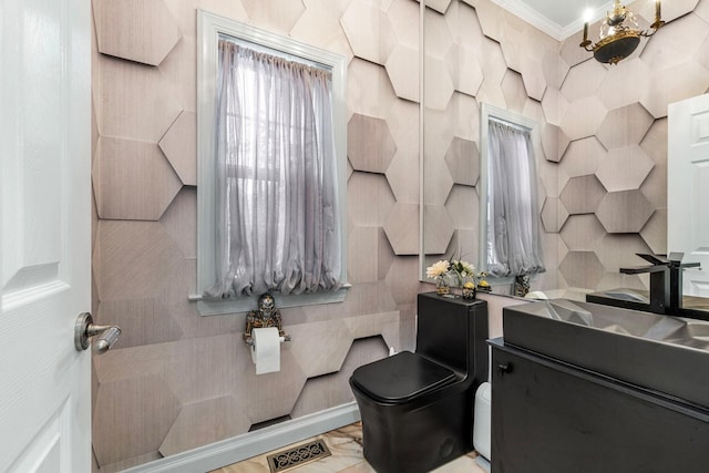 bathroom featuring ornamental molding, toilet, and vanity