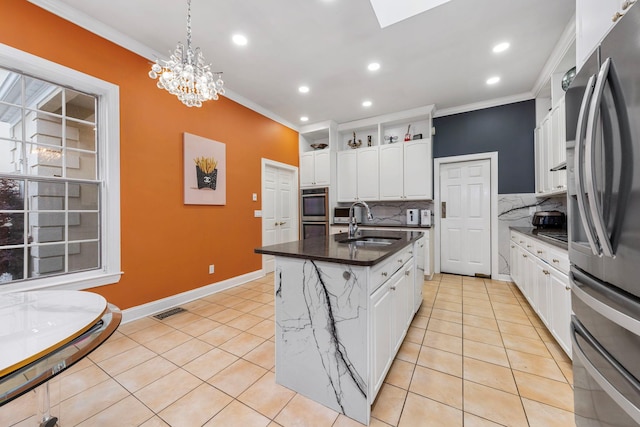 kitchen with appliances with stainless steel finishes, ornamental molding, a sink, tasteful backsplash, and white cabinetry