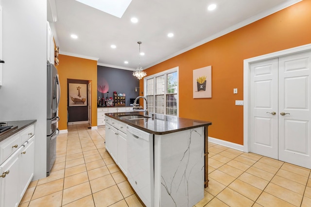 kitchen featuring white dishwasher, a sink, light tile patterned flooring, ornamental molding, and white cabinets