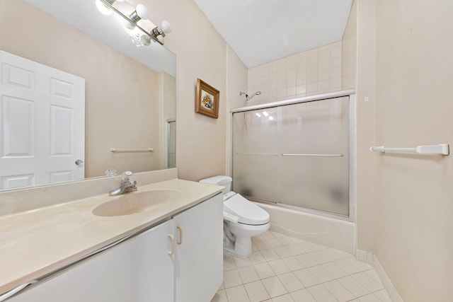 full bath with tile patterned flooring, toilet, vanity, and shower / bath combination with glass door