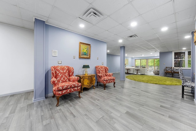 sitting room with wood finished floors and baseboards