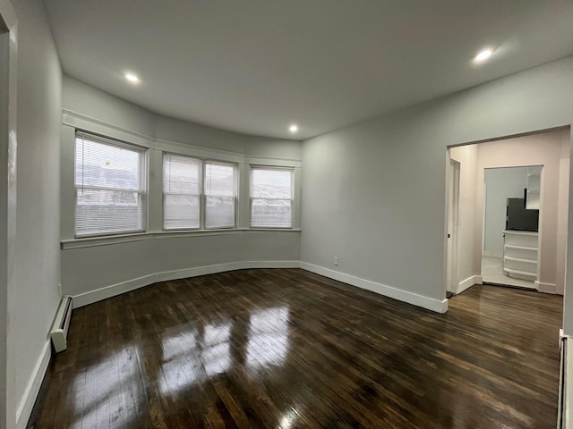 563 E 3rd St, Mount Vernon, NY 10553 - spare room featuring dark wood-type flooring, baseboard heating, healthy amount of natural light, and recessed lighting