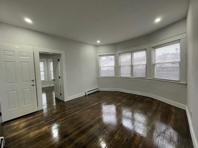 563 E 3rd St, Mount Vernon, NY 10553 - spare room with a baseboard radiator, plenty of natural light, dark wood-type flooring, baseboards, and recessed lighting