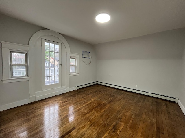 563 E 3rd St, Mount Vernon, NY 10553 - spare room featuring a baseboard heating unit, hardwood / wood-style flooring, and baseboards