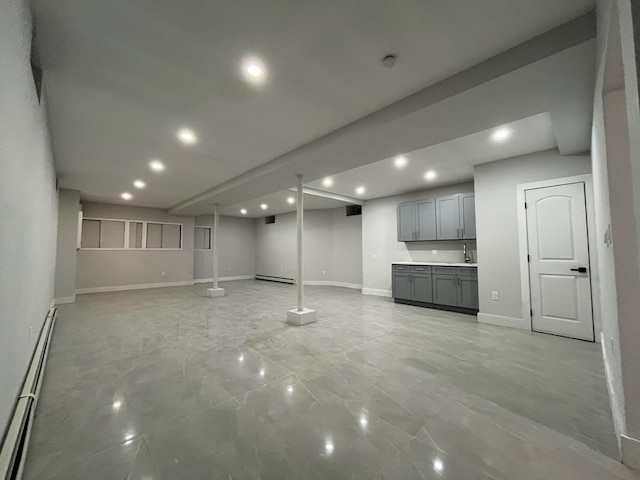 563 E 3rd St, Mount Vernon, NY 10553 - finished basement featuring recessed lighting, a baseboard heating unit, baseboards, and a sink