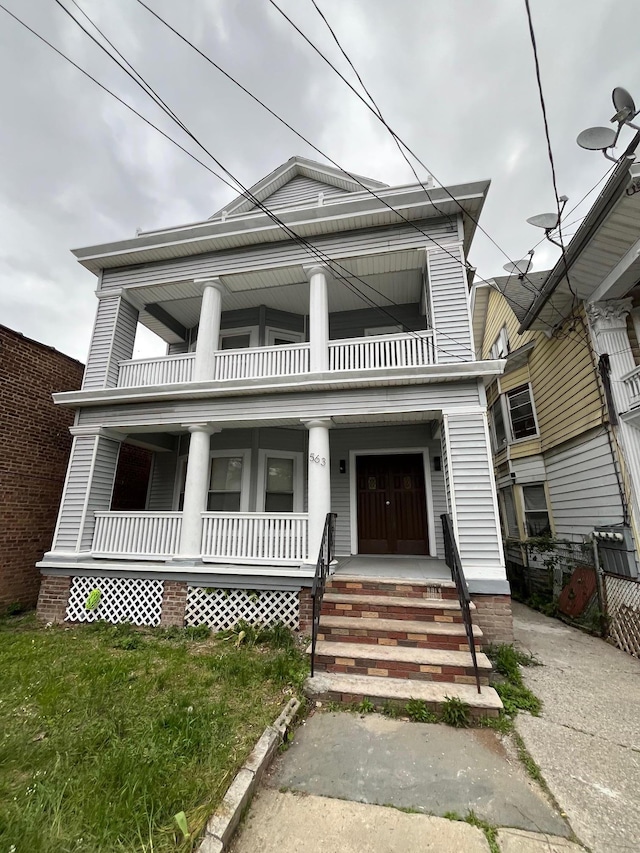 563 E 3rd St, Mount Vernon, NY 10553 - greek revival house featuring a balcony and covered porch