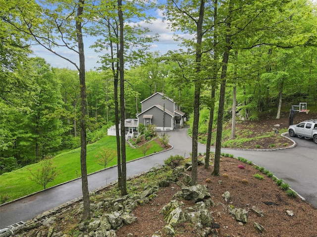 25 Crest Rd, Cold Spring, NY 10516 - view of front of home with driveway, a front yard, and a view of trees