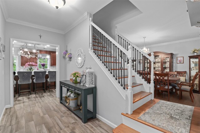 25 Crest Rd, Cold Spring, NY 10516 - staircase with a chandelier, wood finished floors, crown molding, and baseboards