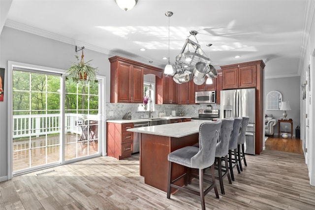 25 Crest Rd, Cold Spring, NY 10516 - kitchen featuring stainless steel appliances, crown molding, light countertops, backsplash, and decorative light fixtures