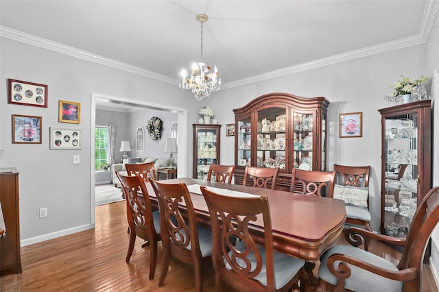 25 Crest Rd, Cold Spring, NY 10516 - dining area with a chandelier, crown molding, wood finished floors, and baseboards