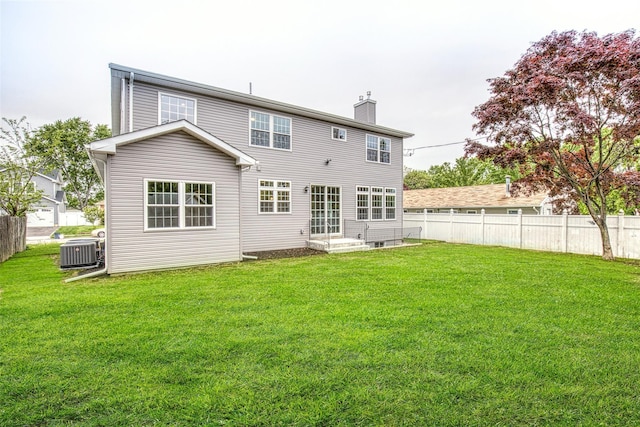 rear view of property featuring central air condition unit, a chimney, and entry steps