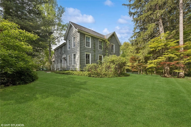 view of property exterior featuring a yard