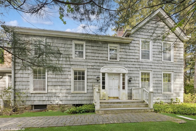 view of front of home with a chimney
