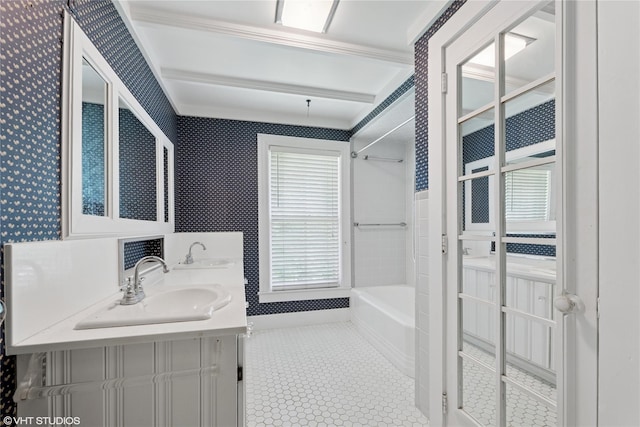 bathroom with double vanity, tub / shower combination, and wallpapered walls