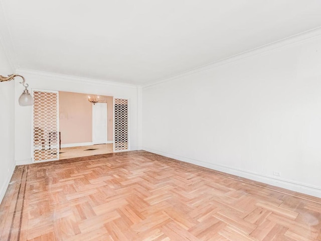 3215 Netherland Ave Unit 6C, Bronx, NY 10463 - spare room with ornamental molding, baseboards, and a chandelier