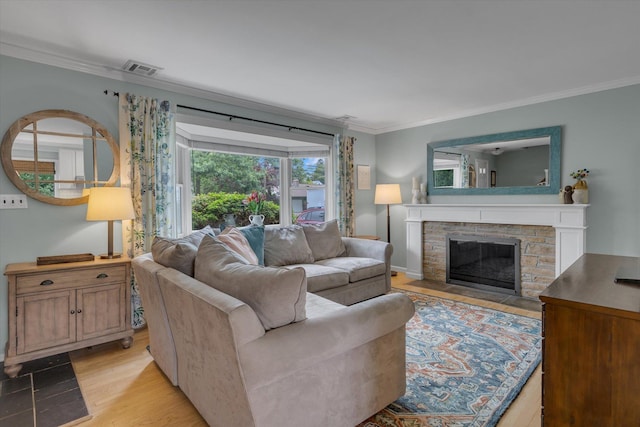 411 8th Ave, East Northport, NY 11731 - living area with crown molding, light wood-style floors, and a fireplace