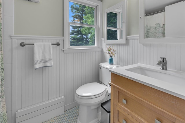411 8th Ave, East Northport, NY 11731 - bathroom with a wainscoted wall, radiator, vanity, plenty of natural light, and curtained shower