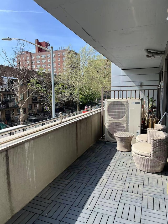 balcony featuring ac unit