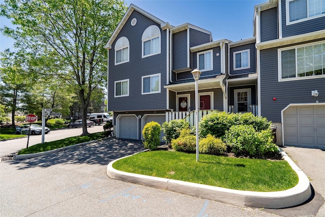 1 Mountain Ter, Nanuet, NY 10954 - view of front facade featuring a garage and driveway