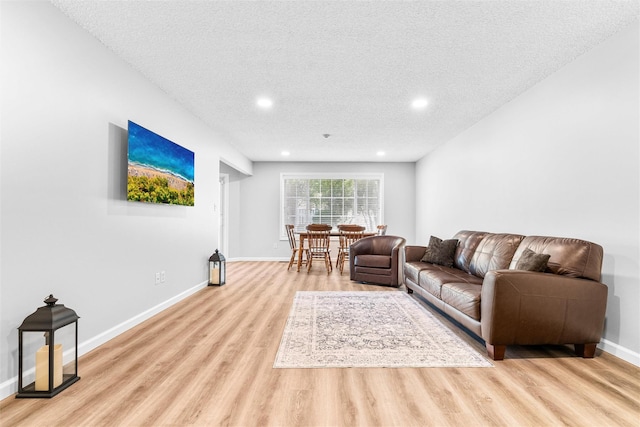 1 Mountain Ter, Nanuet, NY 10954 - living area featuring light wood-style flooring, a textured ceiling, baseboards, and recessed lighting