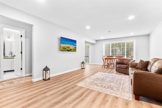 1 Mountain Ter, Nanuet, NY 10954 - living area with light wood-style flooring, recessed lighting, a textured ceiling, and baseboards