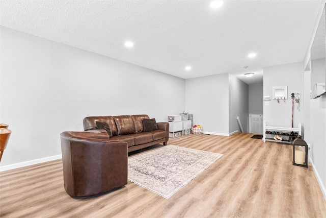 1 Mountain Ter, Nanuet, NY 10954 - living room with light wood finished floors, a textured ceiling, baseboards, and recessed lighting