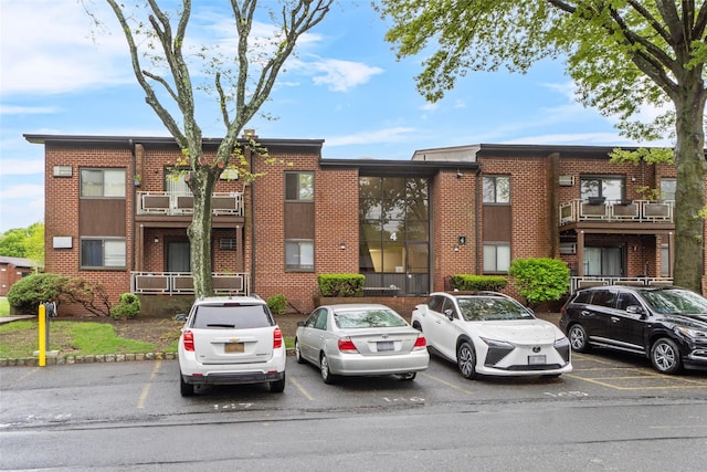 view of property with uncovered parking