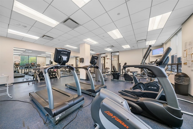 exercise room featuring a drop ceiling