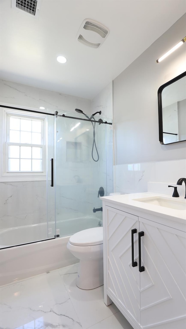 full bath with shower / bath combination with glass door, toilet, vanity, recessed lighting, and marble finish floors