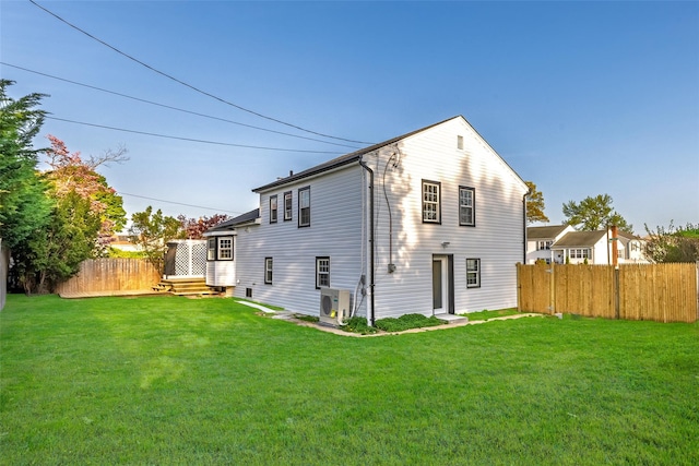 back of house with ac unit