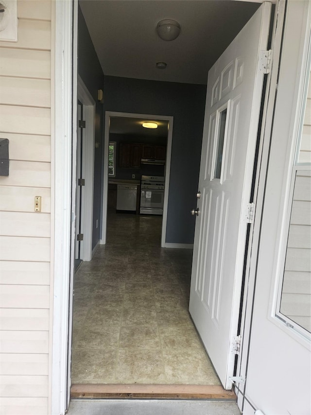 corridor featuring baseboards