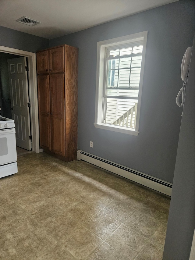 unfurnished bedroom featuring a baseboard radiator and a closet
