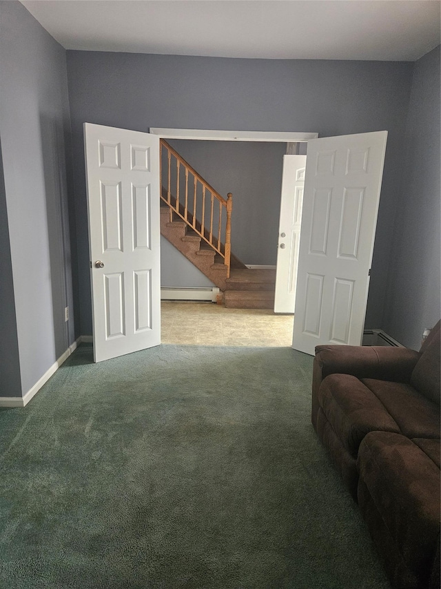 carpeted living area featuring a baseboard heating unit, stairs, and baseboards