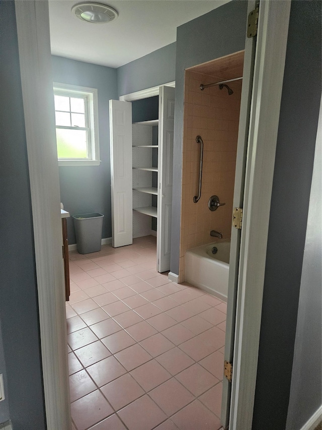 full bath featuring tile patterned floors, bathtub / shower combination, and vanity