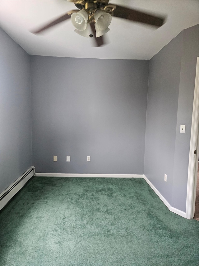 empty room with a ceiling fan, dark colored carpet, baseboard heating, and baseboards