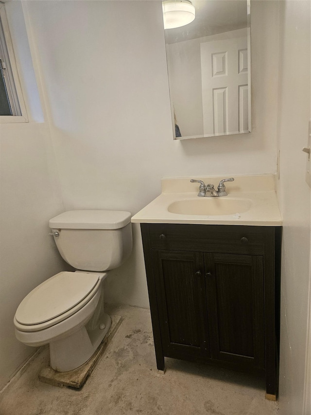 half bath with toilet and vanity