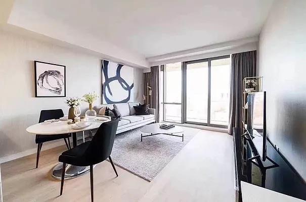134-37 35th Ave Unit 8E, Flushing, NY 11354 - living area featuring baseboards and wood finished floors