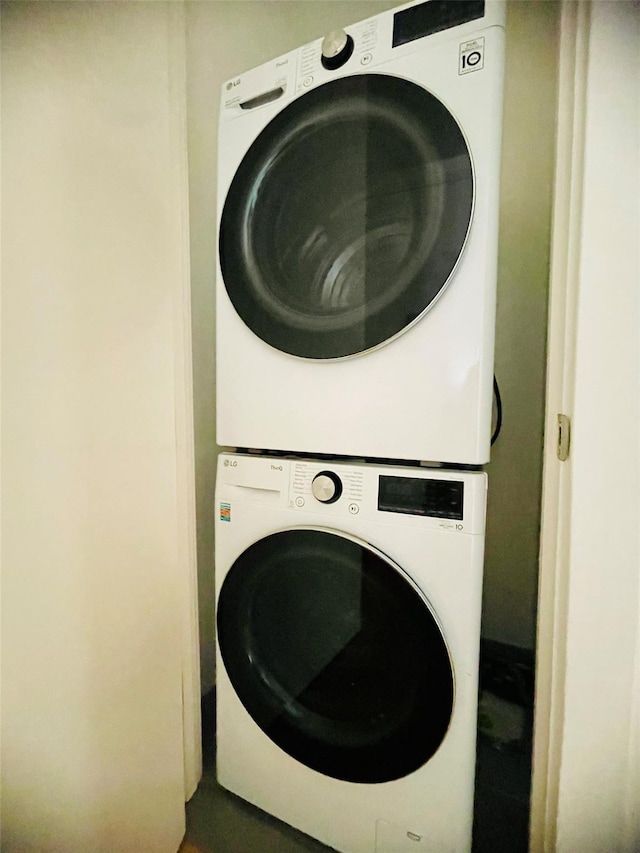 134-37 35th Ave Unit 8E, Flushing, NY 11354 - laundry room featuring stacked washer / drying machine