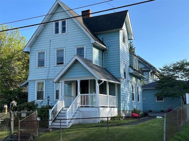22 Herbert St, Beacon, NY 12508 - view of front of property featuring covered porch, roof with shingles, and a chimney