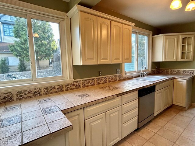 22 Herbert St, Beacon, NY 12508 - kitchen with a sink, stainless steel dishwasher, plenty of natural light, and tile countertops