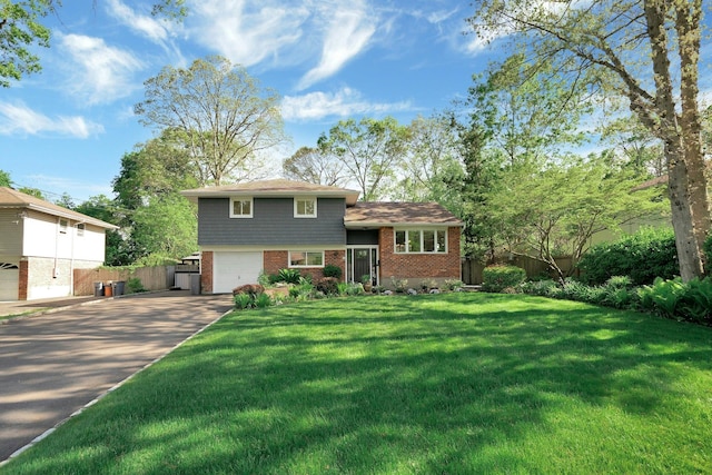 24 Harvard Ln, Commack, NY 11725 - split level home featuring brick siding, driveway, and an attached garage