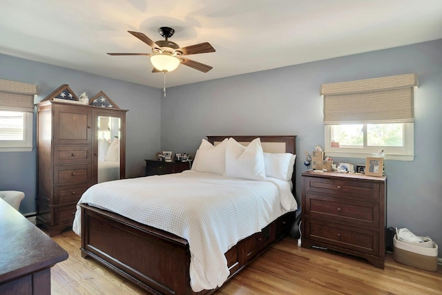 24 Harvard Ln, Commack, NY 11725 - bedroom featuring multiple windows, light wood-type flooring, and ceiling fan