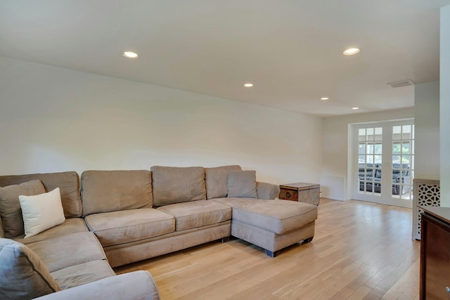 24 Harvard Ln, Commack, NY 11725 - living area with light wood-style floors and recessed lighting