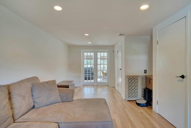 24 Harvard Ln, Commack, NY 11725 - living area with light wood finished floors, recessed lighting, french doors, and baseboards