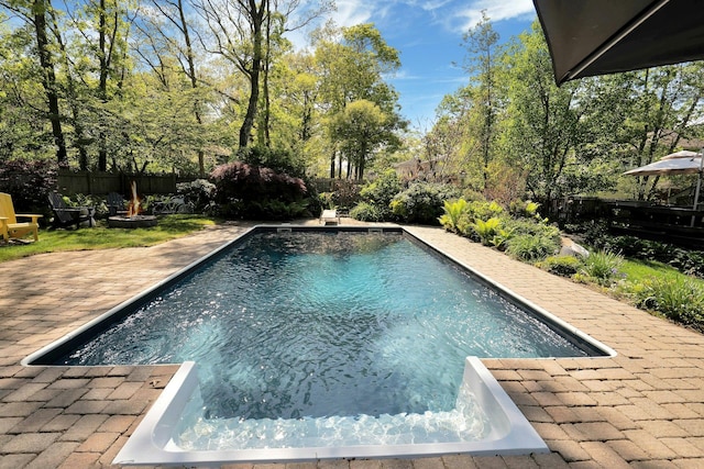 24 Harvard Ln, Commack, NY 11725 - view of pool with an outdoor fire pit, a fenced backyard, and a patio